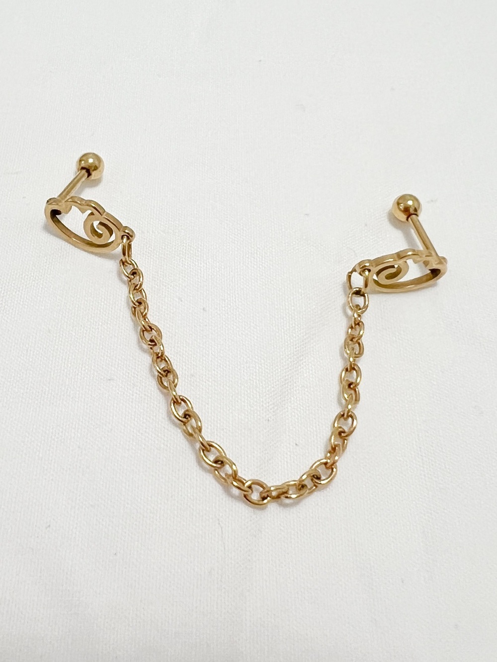 Gold Ear Piercings & Chain Connector